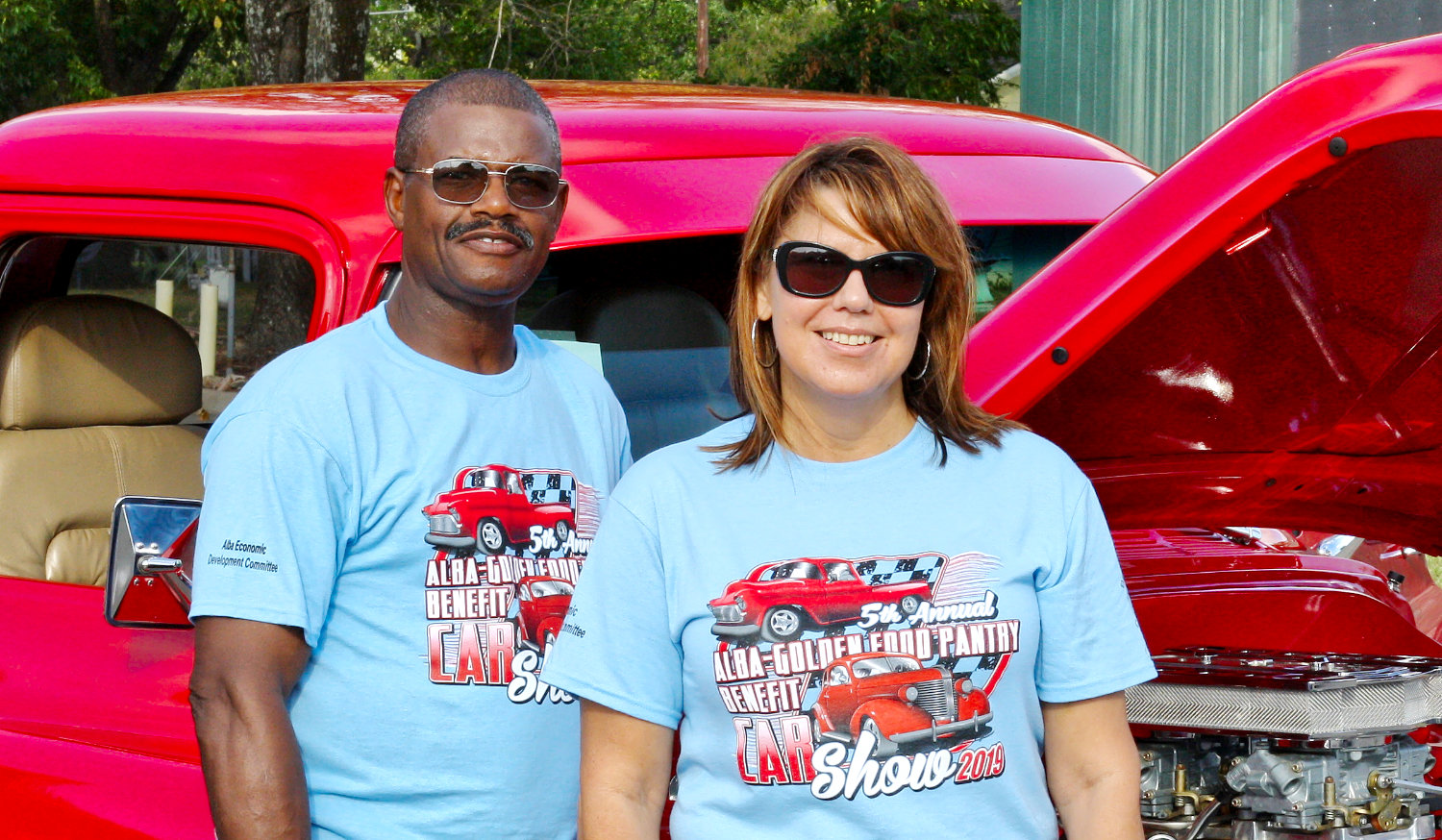 Angie Osborn, food bank coordinator, stands with last year’s Best Truck winner, Lawrence Harper of Big Sandy at Saturday’s Alba Food Bank car show. Harper restored a 1957 Chevy which he purchased in 1996.